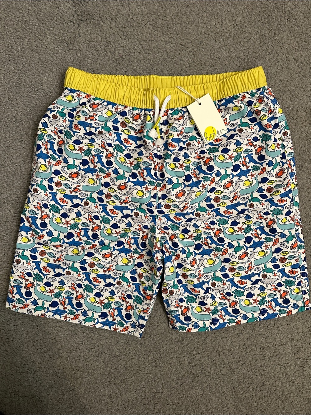Boden Boys’ Yellow-Waistband Multicolor Fish Print Swim Trunks